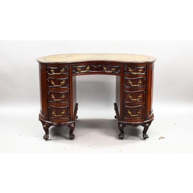 Victorian Mahogany Kidney Shaped Desk A decorative Victorian mahogany kidney shaped desk, of elegant serpentine form and...