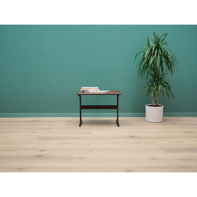 The coffee table was made in the 1960s, Danish production. The legs are made of rosewood. The table top is covered with...