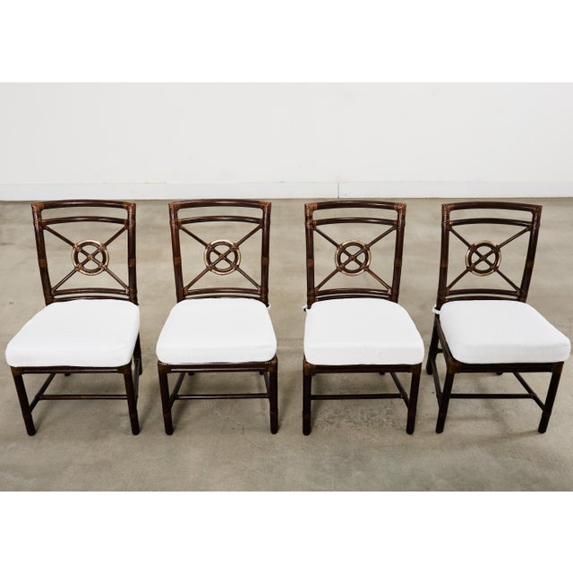 Stunning set of four bespoke organic modern rattan dining chairs designed in the California coastal organic modern style...