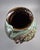 This exceptional antique Japanese pottery vase dates from the late Meiji to early Taisho period (circa 1890–1920). It is a...