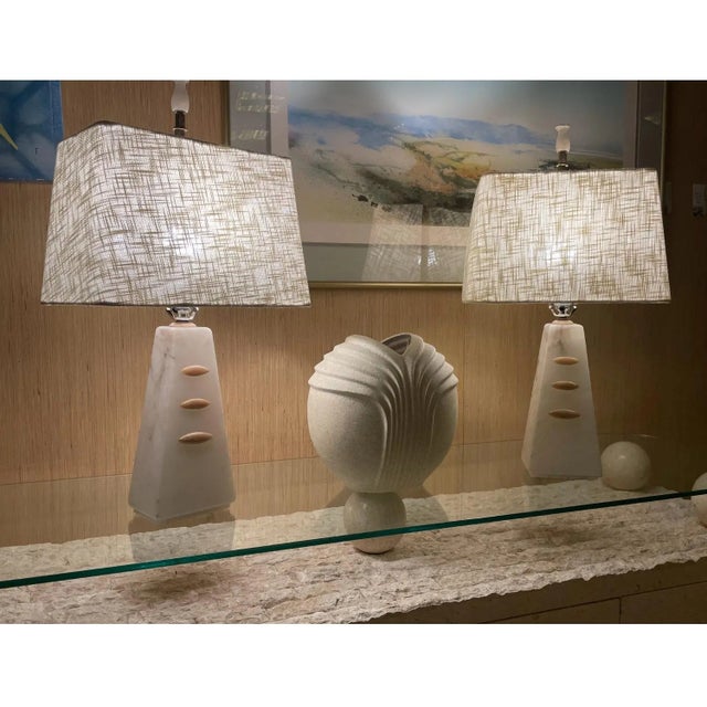 Pair of pyramid shaped vintage alabaster lamps. Acquired from the original owner who purchased them in the mid-1950s in...