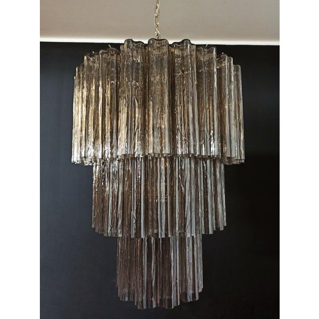 Italian vintage chandelier in murano glass and nickel-plated metal structure. The armor polished nickel supports 52 large...