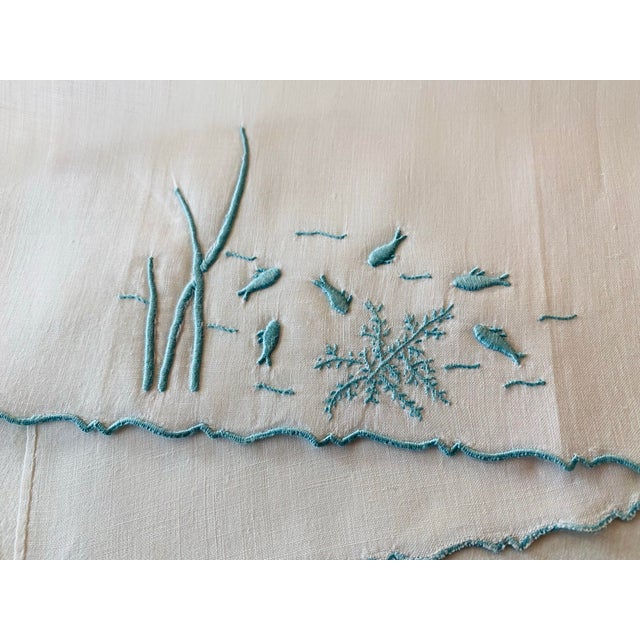 Exquisitely hand embroidered by Marghab and Co. of Madeira, Portugal, a vintage guest towel in aqua blue cotton embroidery...