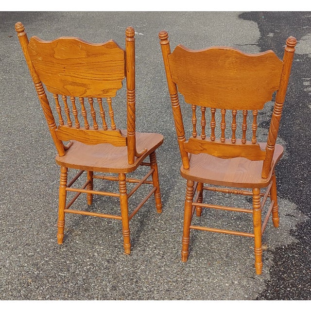 beautifully carved pressed back dining chairs in overall good vintage condition. Each seat is is constructed from selected...