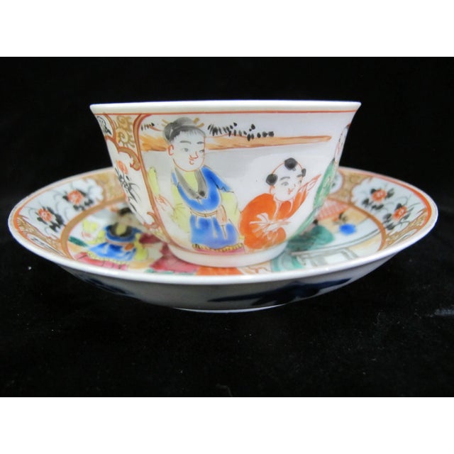 Chinese porcelain Famille Rose tea cup or bowl and saucer set. Colorful hand painted figural design. In excellent...