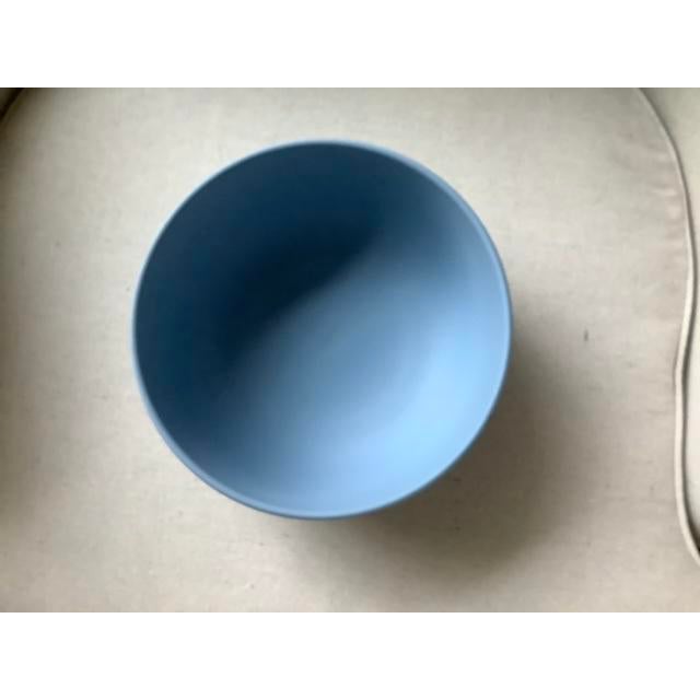 Wedgewood Bowl in excellent condition. Beautiful trademark blue with white raised design. Excellent sizable piece for your...