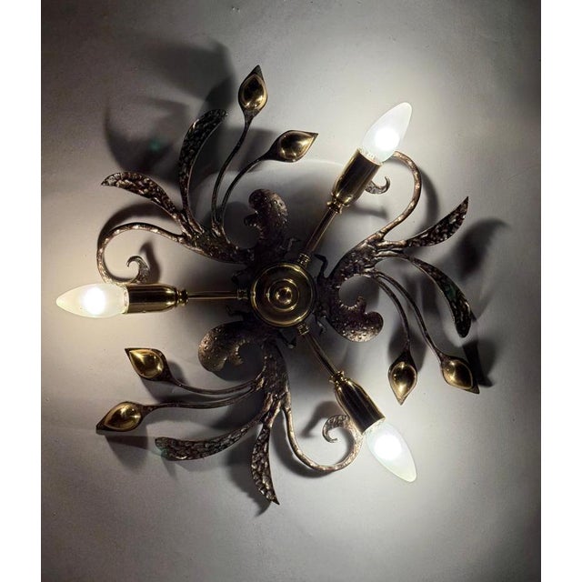 I'd love to show you this lovely ceiling or wall lamp. It's a truly one-of-a-kind piece with a sweeping, organic design...
