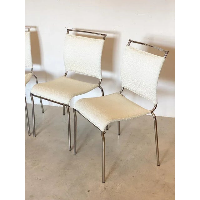 Set of 4 90s chairs of the Calligaris company, chromed steel structure and nylon fabric This piece has an attribution...