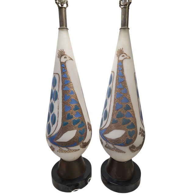 Stunning pair of gilded Peacock motif glass table lamps. Very tall, these stand 44" high with the harp. No shades included.