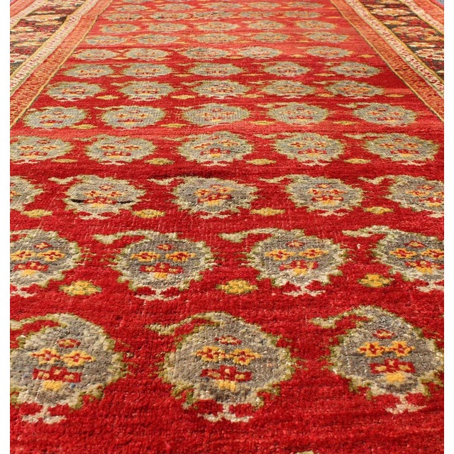 Tribal Vintage Turkish Oushak Rug in Rich Red With Allover Floral Rosette Pattern For Sale - Image 3 of 8