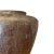 A dark, earthy treasure with a rich past. This handcrafted clay vessel comes from Indonesia, where it was once an...