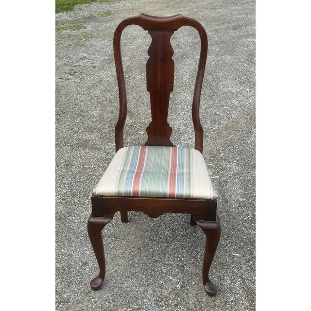 Timeless pair of solid cherry side chairs by Pennsylvania House. Features Queen Anne styling , cabriole legs and...
