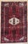 Antique hand-knotted rug from the Hamedan region of western Iran, featuring a dense all-over geometric pattern arranged...