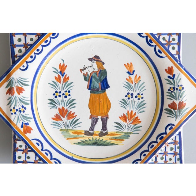 A rare antique French faience Quimper star shaped plate, circa 1920. Maker's mark on reverse. This charming plate is...
