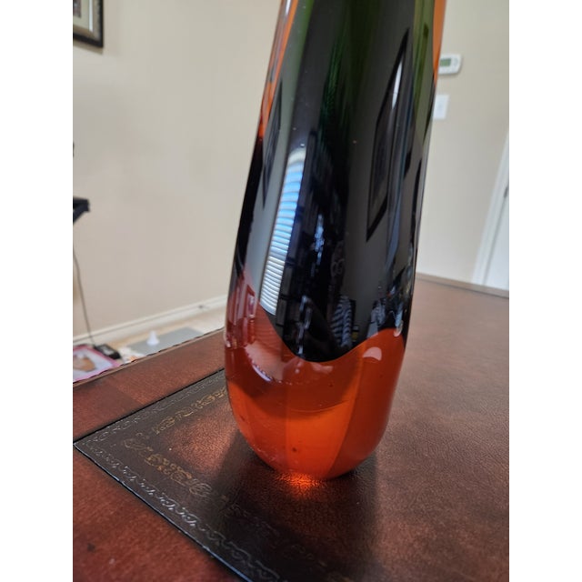 A stunning, substantial example of Mid-Century Modern Italian art glass. This triple-cased Sommerso vase features a...