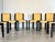 Set of 6 black lacquered wood chairs with yellow fabric seat and backrest, designed by Joe Colombo in 1966 for Pozzi...