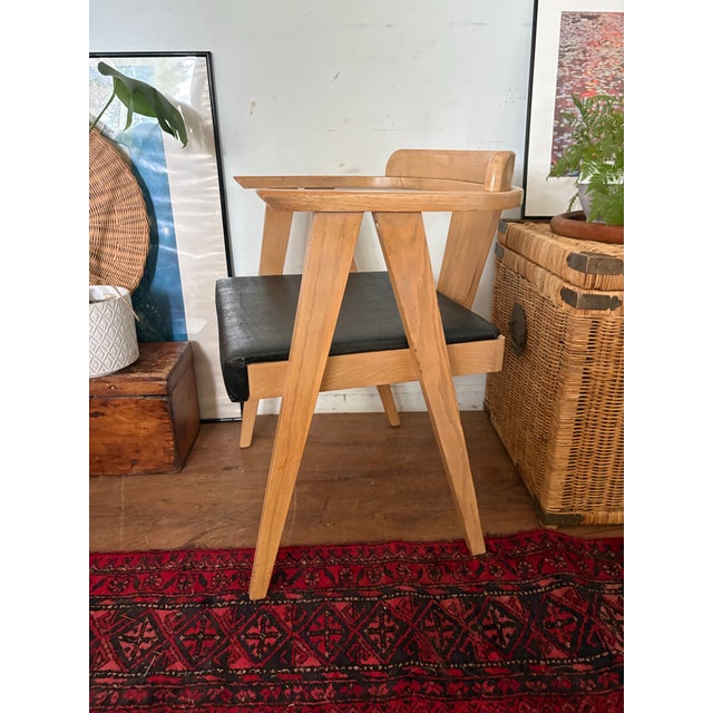 Vintage MCM compass chair in the style of Allan Gould. A sturdy eye-catching piece with the unique “compass” style angled...