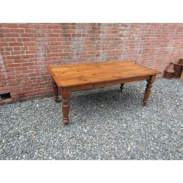 Embrace classic country charm with this beautiful Antique English Reclaimed Pine Farm Table. Crafted from old, reclaimed...