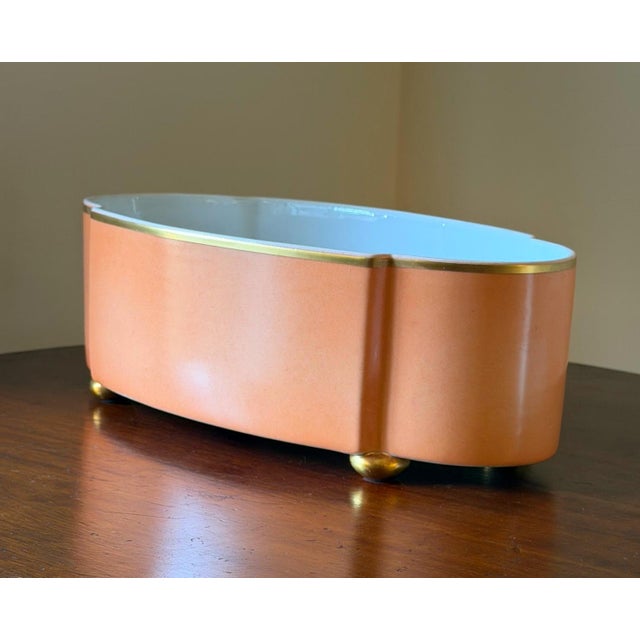 This is a charming 1970's Mottahedeh salmon and white porcelain oval quatrefoil shape. This was produced by Vista Alegre...