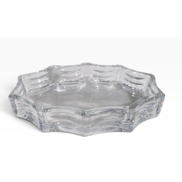 Impressive large Baccarat centerpiece bowl. The bowl has ten sides, each with three carved oblong elements. The bowl is in...