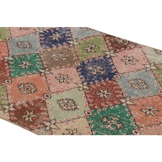 Hand-knotted in wool and originating from Turkey circa 1960 – 1970, this 3x6 vintage Zeki Müren runner is a unique...