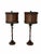 Pair of faux bamboo table lamps with woven shades. The lamps have a bamboo-like design and come with matching woven...