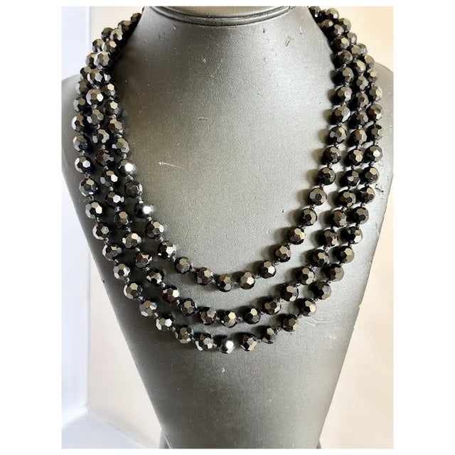 I love these 1920s era Opera Length necklaces. This one is French Jet Beads which are faceted. In absolutely pristine...