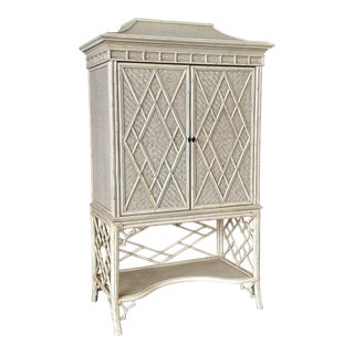 Late 20th Century Coastal Distressed Woven Rattan Pagoda Fretwork Chippendale Style Cabinet For Sale