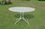 Wrought Iron Patio Set With Dogwood Motifs—Table and Four Armchairs With Covers, 5 Pieces For Sale - Image 11 of 18