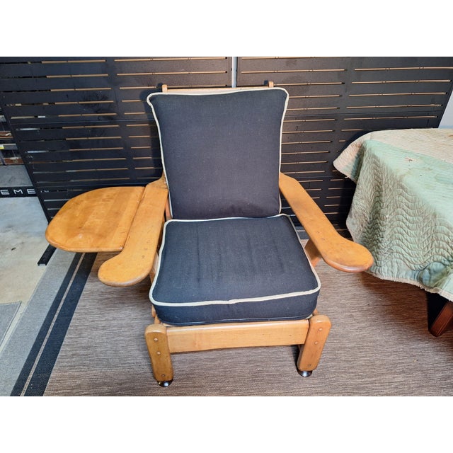 Side fold up attached table. 2 reclining positions besides the upright position.