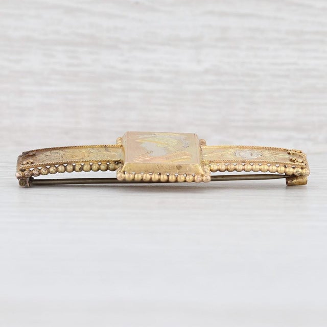 This great antique brooch dates from circa 1860 - 1870s and features finely detailed engraved floral and figural designs....