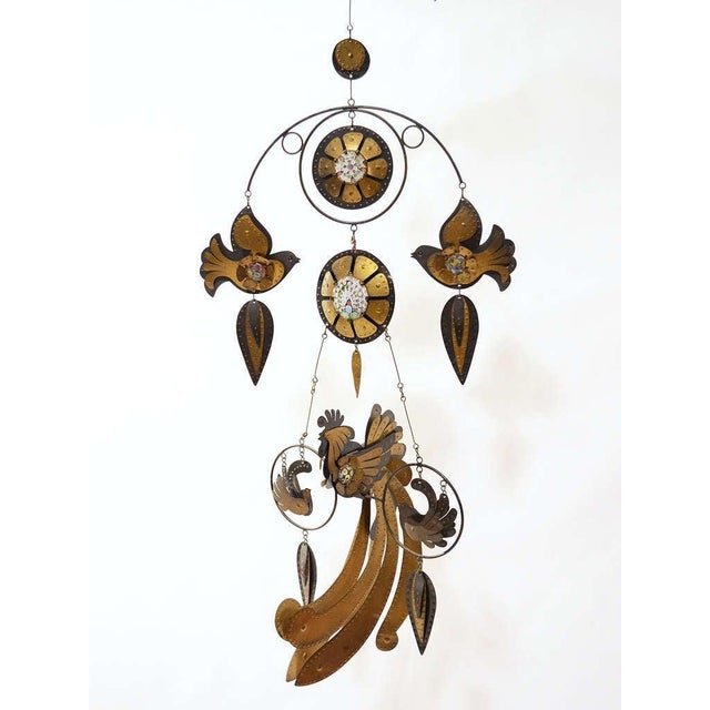 This fanciful mobile is pure delight. Festooned with birds, flowers and leaves, this by Chilean artist Cesar Vasquez...