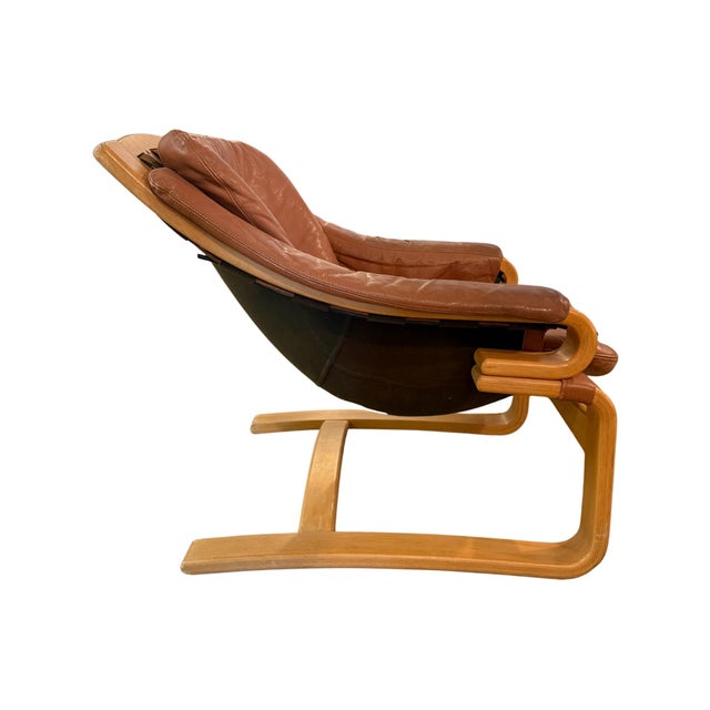 Vintage mid-century Danish modern brown leather and bentwood cantilever beech lounge chair Attributed to Svend Skipper for...