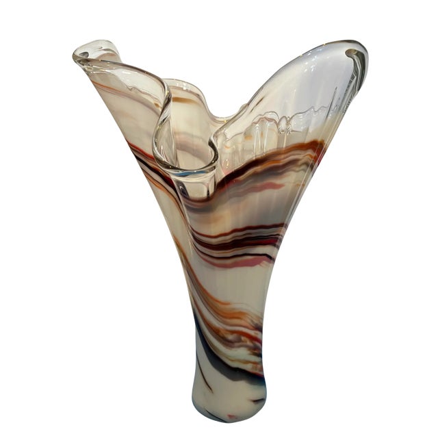 This exquisite 16.5-inch tall art glass vase is a stunning example of Murano craftsmanship. Handblown by skilled artisans...