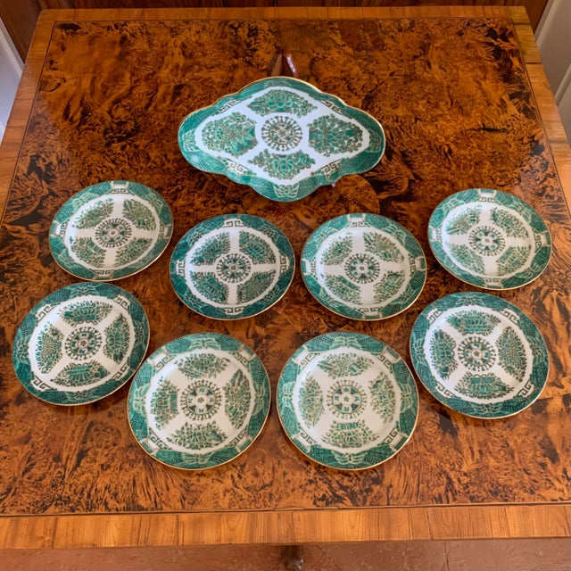 A charming set of eight Fitzhugh Pattern butter plates in green, together with a matching small vegetable serving dish....