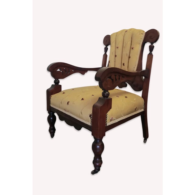 Stately 19th-century American Victorian Renaissance Revival accent armchair with a commanding silhouette. Crafted from...
