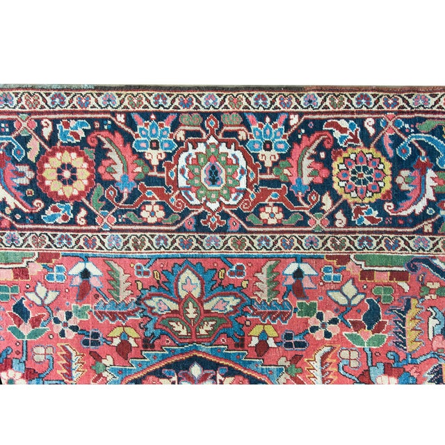 A stunning early 20th century Persian Heriz rug with the most wonderful and elaborate pattern containing a large central...