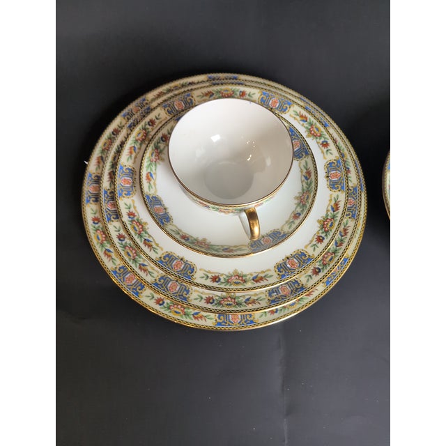 An elegant antique French Limoges porcelain dinner service for four, retailed by Stern Brothers of New York at the turn of...