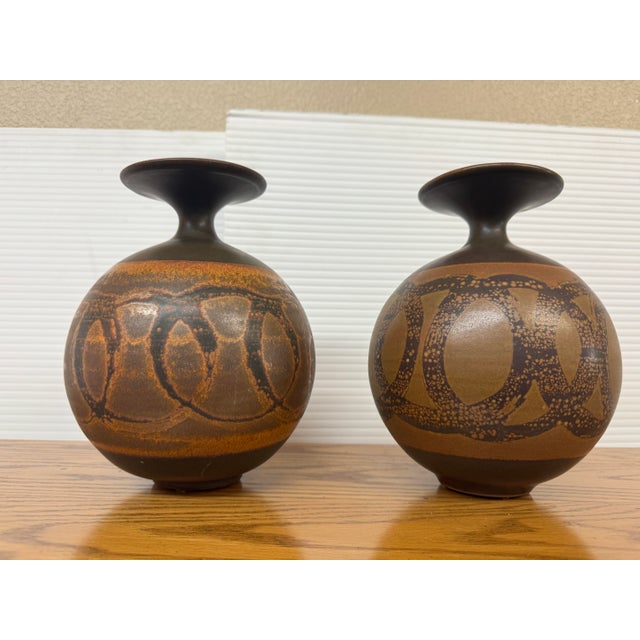 Design Plus Gallery presents a Set of Two Spherical Vases from Designs West Stoneware. The vases are from the mid 1960s...