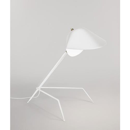 Table lamp model 'tripod lamp' designed by serge mouille in 1954. manufactured by editions serge mouille in france. The...