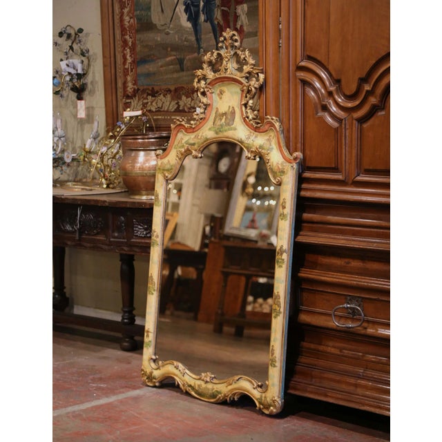 Richly decorative and full of character, this antique Italian wall mirror was crafted circa 1880 in the Louis XV taste....