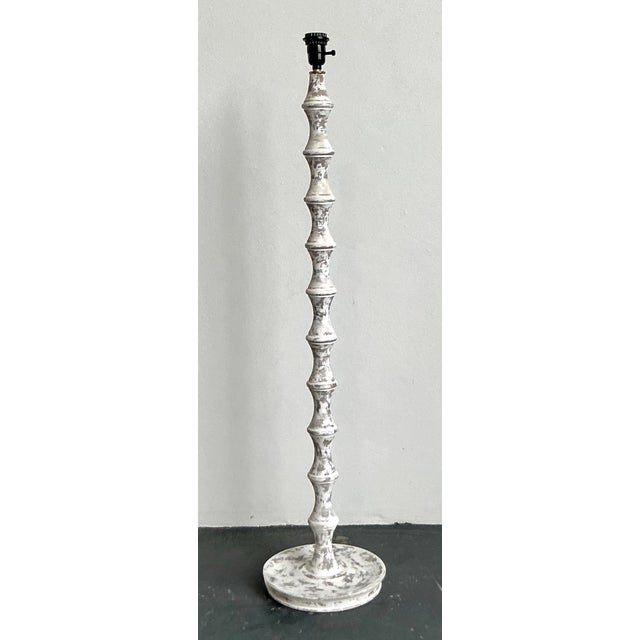 This striking pair of vintage floor lamps is a masterclass in organic, sculptural design, offering an authoritative...