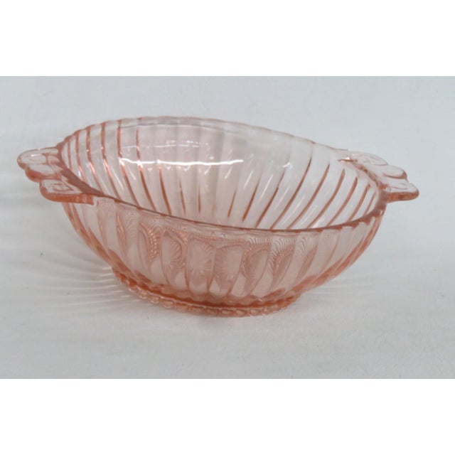 This beautiful Small Serving Bowl is made out of depression glass. This lovely serving dish features a vertical ribbing...