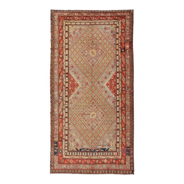 Large Antique Khotan Gallery Rug With Layered Diamond Design in Yellow, Orange, Brown & Gray For Sale