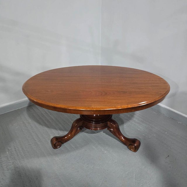 A superb quality centre pedestal Victorian Mahogany oval coffee table with protective glass top, in excellent order...