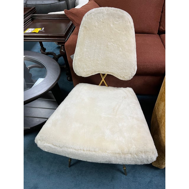 The Jonathan Adler Maxime Lounge Chair is the ultimate expression of bold, mid-century modern glamour. Adapting the iconic...