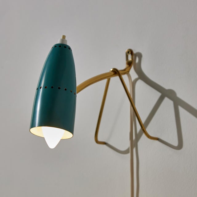 A tiny and charming piece. Austrian brass and metal lamp from the 1950s designed by Rupert Nikoll. The lamp is...