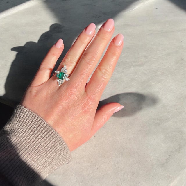 Marquise Ring from the 1990s, 18-Carat White Gold, Colombian Emerald and Diamonds This contemporary ring from the 1990s is...