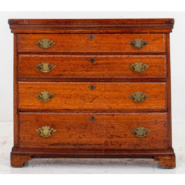 American Oak Chest of Four Drawers, 19th or 20th century, in the federal taste and of rectangular form, with four long...