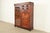 A gorgeous antique Victorian smoker's display cabinet with drop-front desk In the manner of R.J. Horner & Co. USA, Circa...